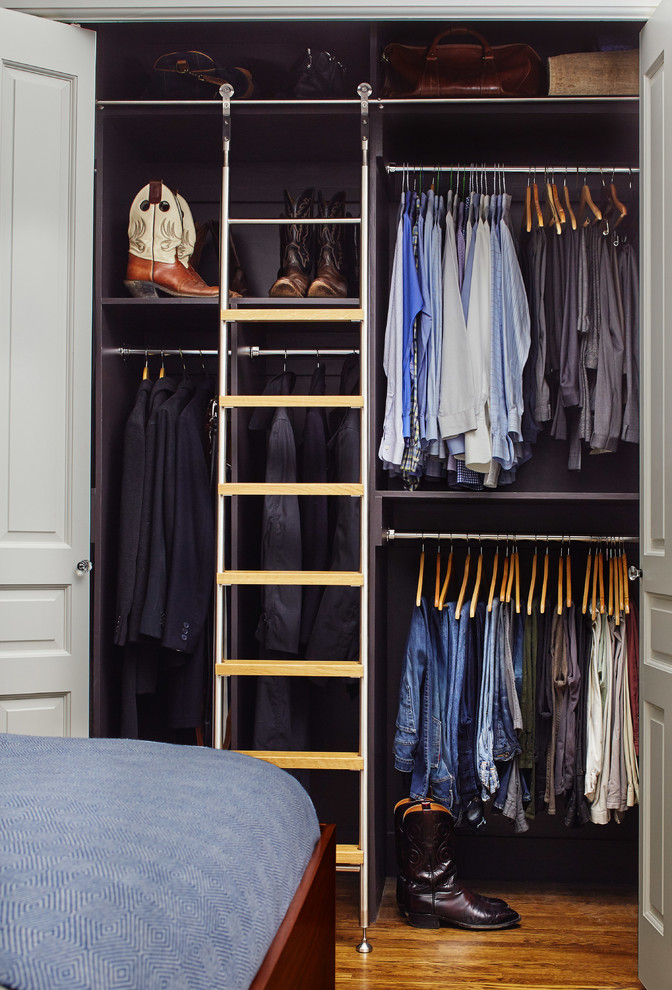 This is an example of a mid-sized traditional men's built-in wardrobe in San Francisco with dark hardwood floors and brown floor.