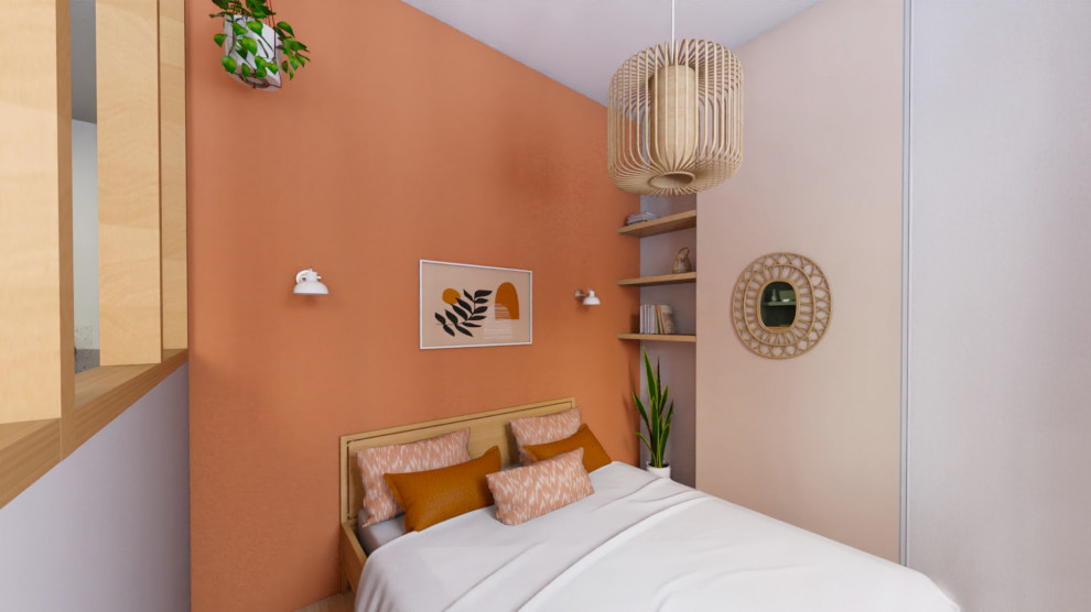 Immagine di una camera da letto design con pareti arancioni e parquet chiaro