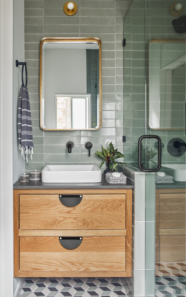 Inspiration for a mid-sized transitional 3/4 bathroom in Atlanta with light wood cabinets, an alcove shower, green tile, ceramic tile, ceramic floors, multi-coloured floor, a hinged shower door, grey benchtops, flat-panel cabinets, a vessel sink, a single vanity and a floating vanity.