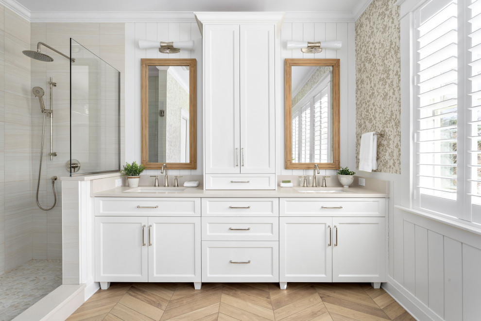 Example of a mid-sized transitional master beige tile wood-look tile floor, beige floor, double-sink, shiplap wall and wallpaper alcove shower design with shaker cabinets, white cabinets, an undermount sink, quartz countertops, beige countertops, a built-in vanity and multicolored walls