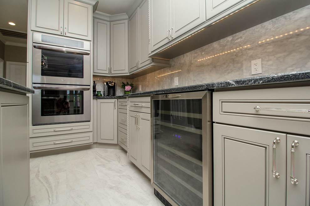 Example of a large transitional l-shaped porcelain tile and white floor eat-in kitchen design in Houston with a single-bowl sink, beaded inset cabinets, gray cabinets, granite countertops, white backsplash, marble backsplash, stainless steel appliances, two islands and black countertops