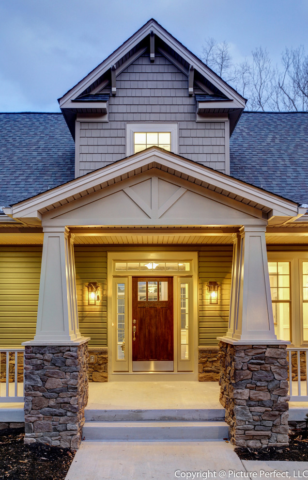 Inspiration for an arts and crafts two-storey beige exterior in Baltimore with vinyl siding.