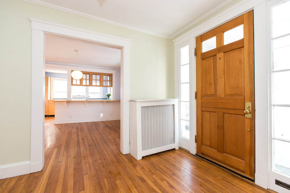 Mid-sized traditional front door in Boston with green walls, medium hardwood floors, a single front door and a medium wood front door.