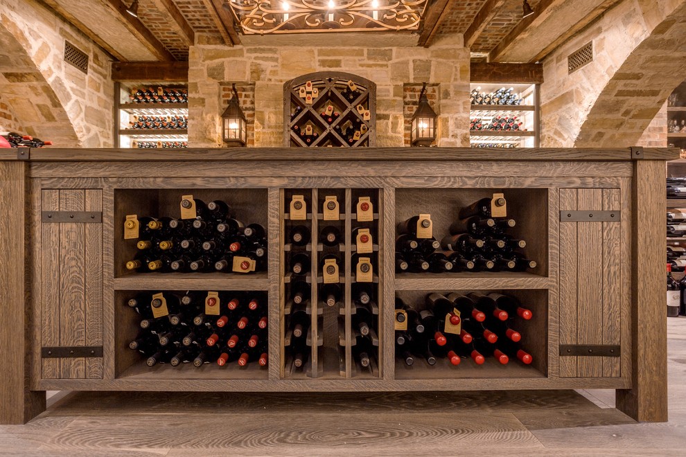 Design ideas for a large country wine cellar in Baltimore with medium hardwood floors and display racks.