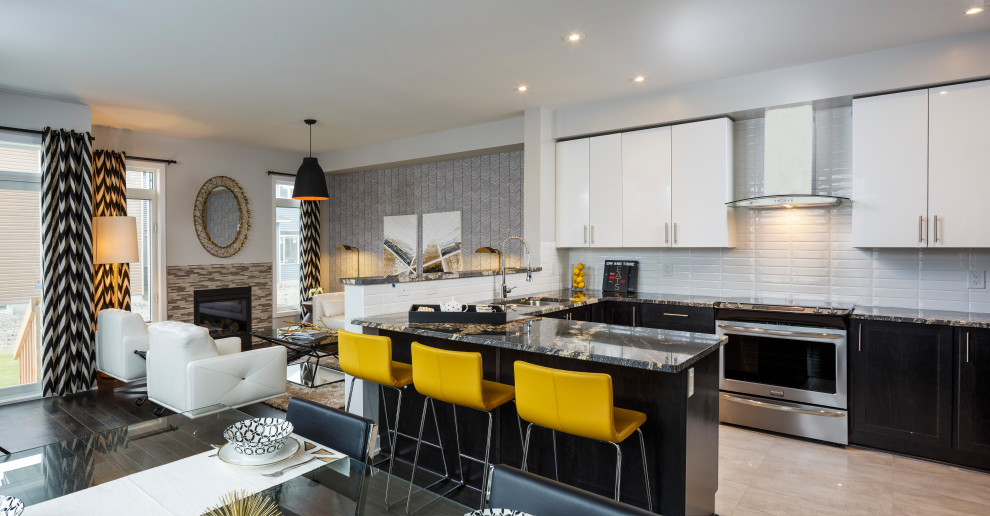 Small transitional u-shaped porcelain tile and gray floor open concept kitchen photo in Ottawa with an undermount sink, flat-panel cabinets, white cabinets, granite countertops, white backsplash, subway tile backsplash, stainless steel appliances, a peninsula and black countertops