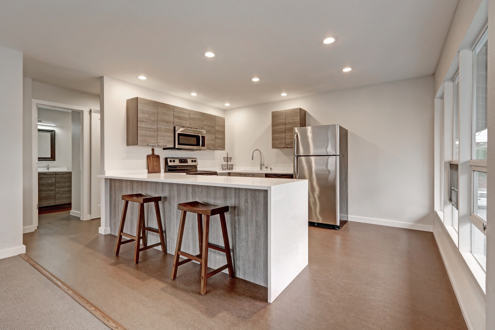 Inspiration for a modern kitchen remodel in Chicago with an undermount sink, flat-panel cabinets, gray cabinets, quartz countertops and white countertops