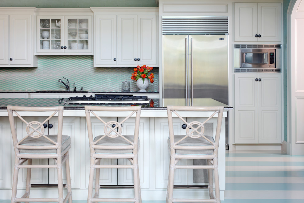 Inspiration for a mid-sized traditional single-wall eat-in kitchen in Little Rock with an undermount sink, raised-panel cabinets, white cabinets, blue splashback, stainless steel appliances, painted wood floors and with island.