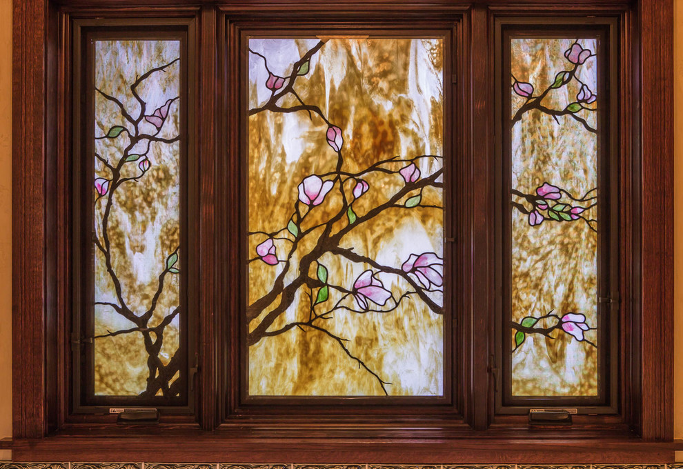 Inspiration for a transitional kitchen remodel in Denver with glass-front cabinets and dark wood cabinets