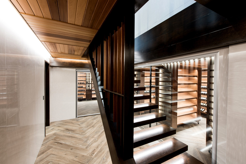 Design ideas for an expansive tropical wine cellar in Gold Coast - Tweed with storage racks.