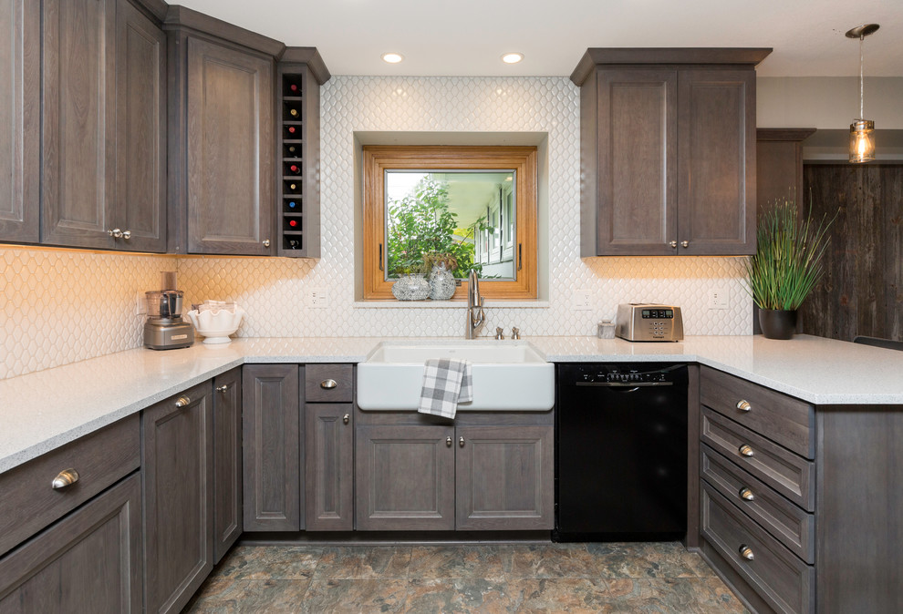 Mid-sized transitional l-shaped vinyl floor and gray floor eat-in kitchen photo with a farmhouse sink, recessed-panel cabinets, gray cabinets, quartz countertops, white backsplash, ceramic backsplash, stainless steel appliances, no island and white countertops