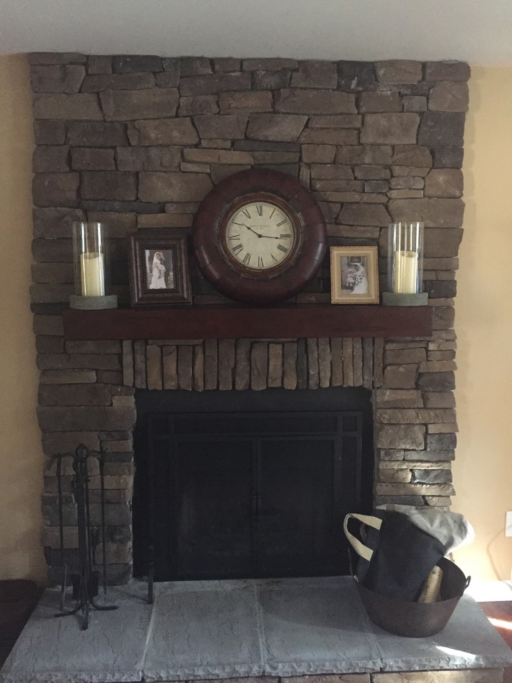 Uneven sides of stone veneer fireplace