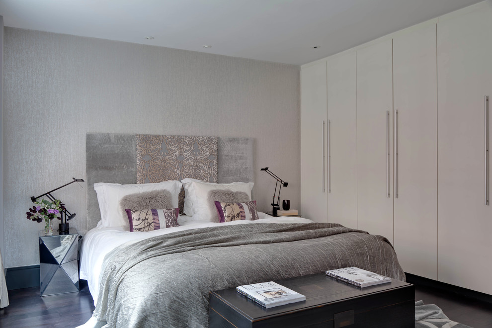 Design ideas for a small contemporary master bedroom in London with grey walls and dark hardwood floors.
