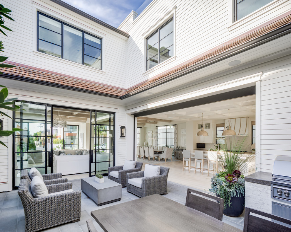 Example of a beach style home design design in Orange County