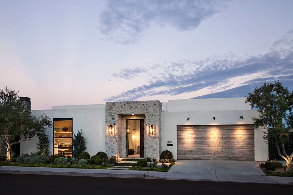 Large transitional one-storey stucco white exterior in Orange County with a flat roof.