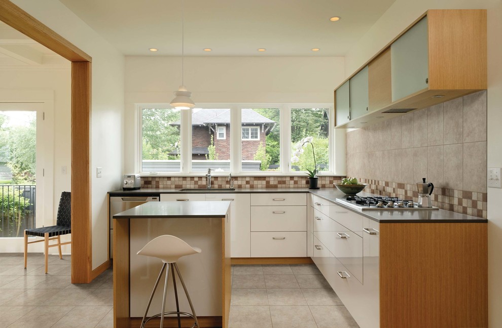 Large transitional porcelain tile eat-in kitchen photo with brown backsplash, ceramic backsplash, white walls and an island