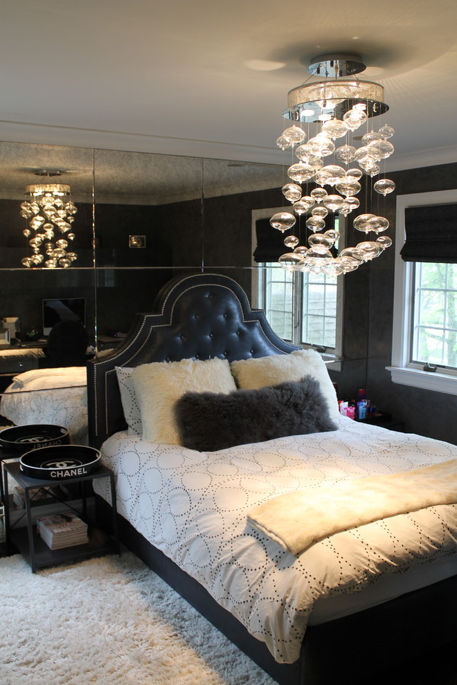 Mid-sized traditional guest bedroom in New York with black walls and carpet.
