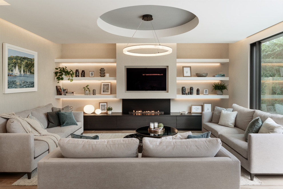Photo of a large contemporary formal and grey and brown open plan living room with beige walls, ceramic flooring, a metal fireplace surround, brown floors, a coffered ceiling, wallpapered walls and a chimney breast.