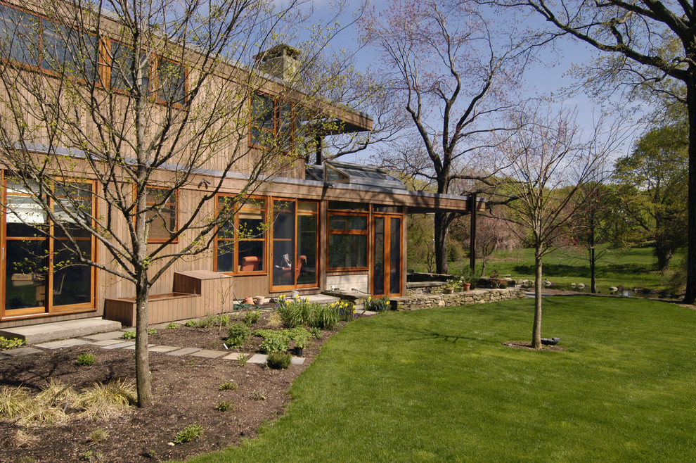 This is an example of a contemporary two-storey brown exterior in Boston.
