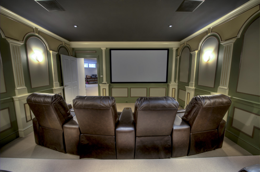 Design ideas for a mid-sized traditional enclosed home theatre in DC Metro with beige walls and a projector screen.