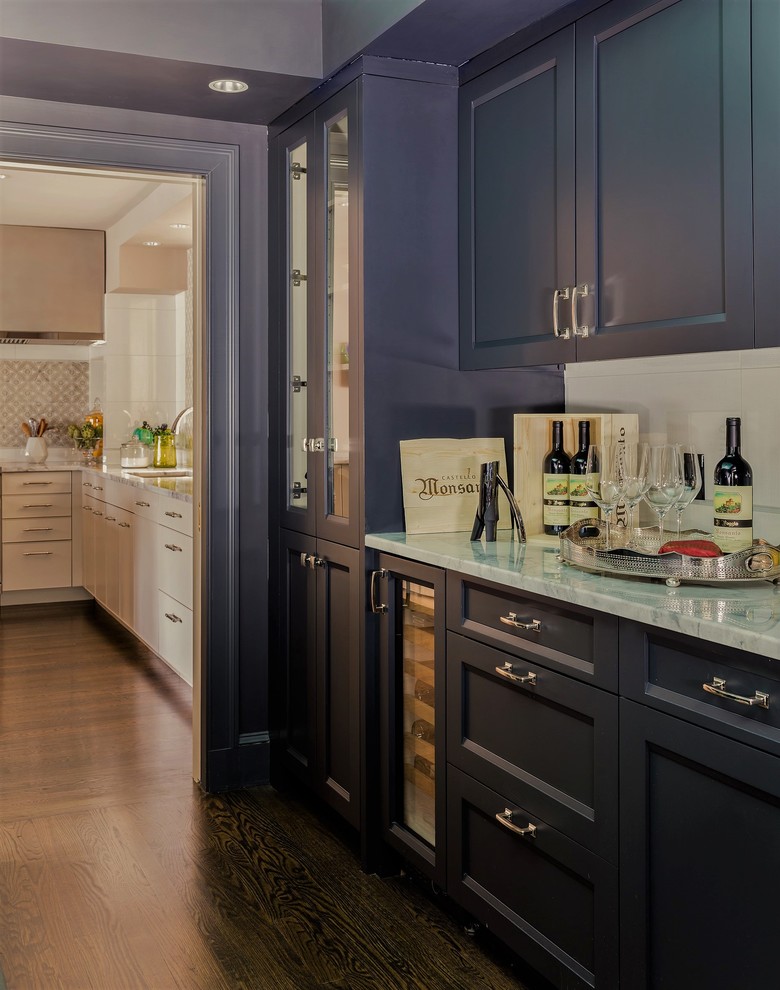 Example of a mid-sized transitional galley dark wood floor kitchen pantry design in Boston with recessed-panel cabinets, gray cabinets, granite countertops, white backsplash and porcelain backsplash