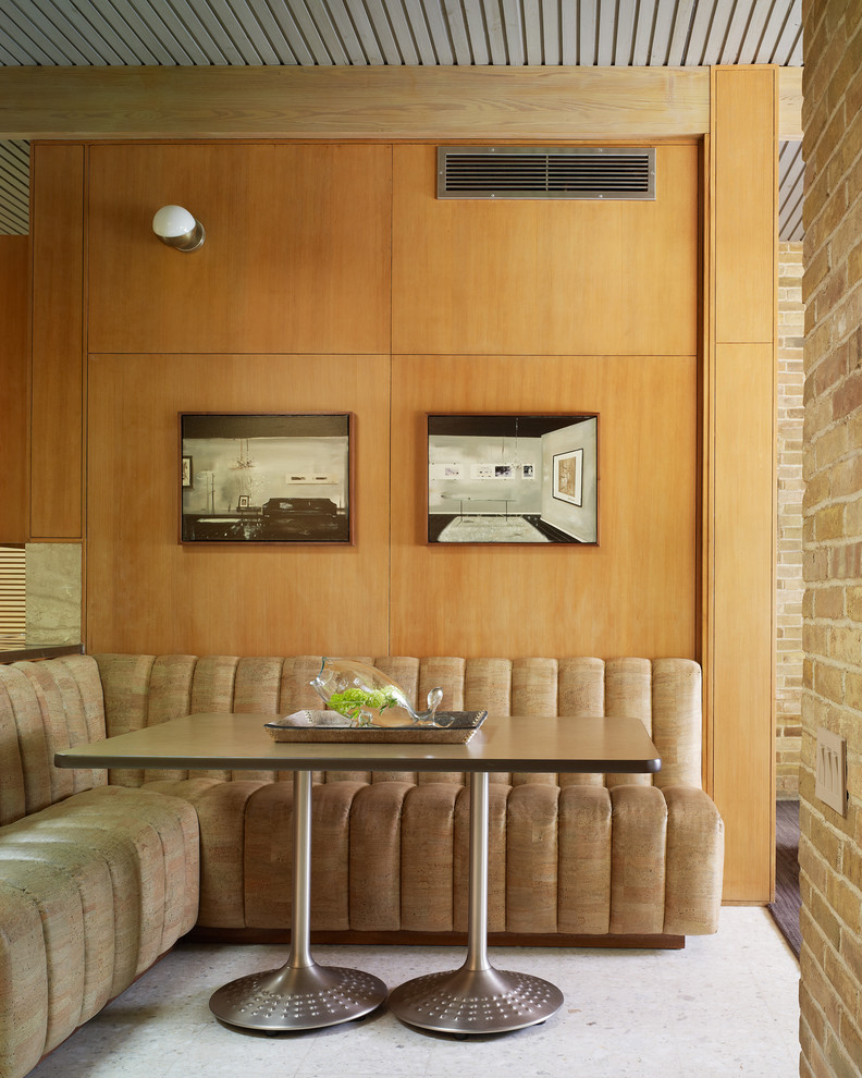 This is an example of a midcentury kitchen/dining combo in Dallas.
