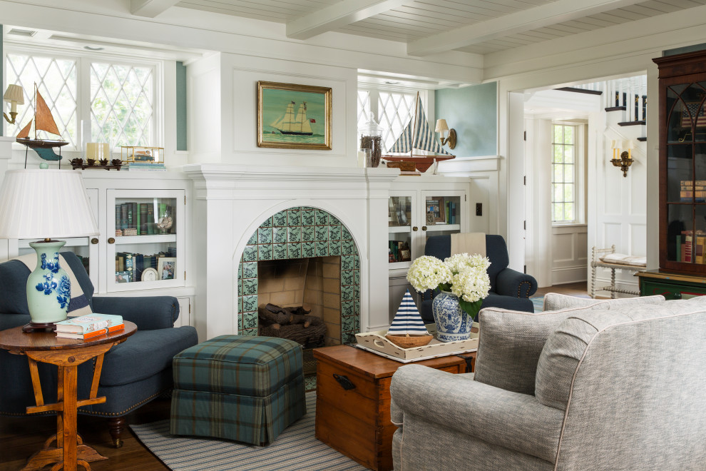 Design ideas for a nautical enclosed games room in Minneapolis with a reading nook, blue walls, dark hardwood flooring, a standard fireplace, a tiled fireplace surround, exposed beams, a timber clad ceiling and a chimney breast.