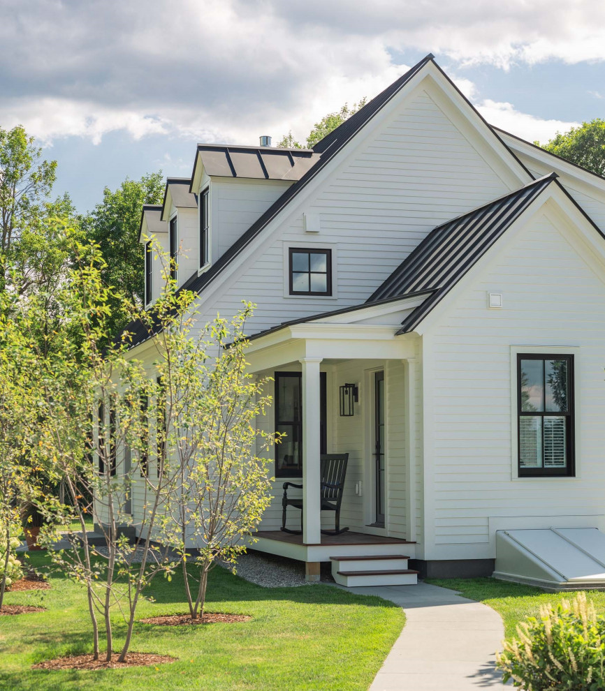Example of a country exterior home design in Burlington
