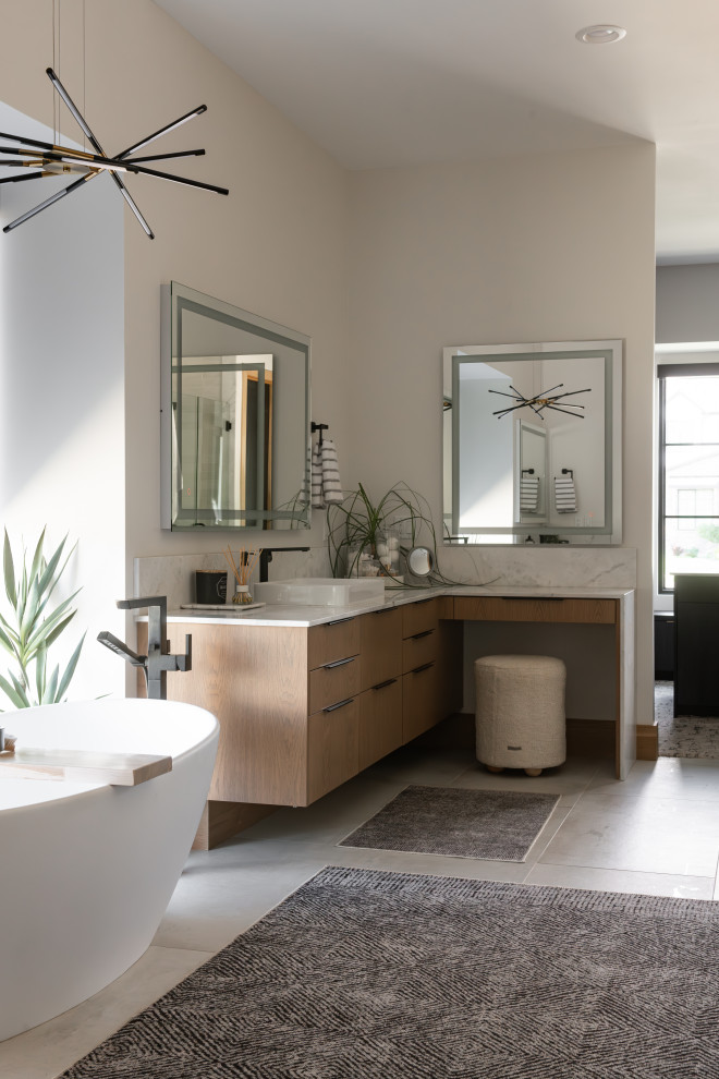 Large modern master bathroom in Salt Lake City with flat-panel cabinets, brown cabinets, a freestanding tub, an alcove shower, a two-piece toilet, white walls, porcelain floors, a vessel sink, marble benchtops, beige floor, a hinged shower door, multi-coloured benchtops, an enclosed toilet, a double vanity and a floating vanity.