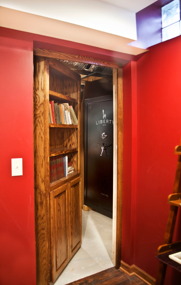 Inspiration for a mid-sized traditional basement in Milwaukee with red walls and no fireplace.