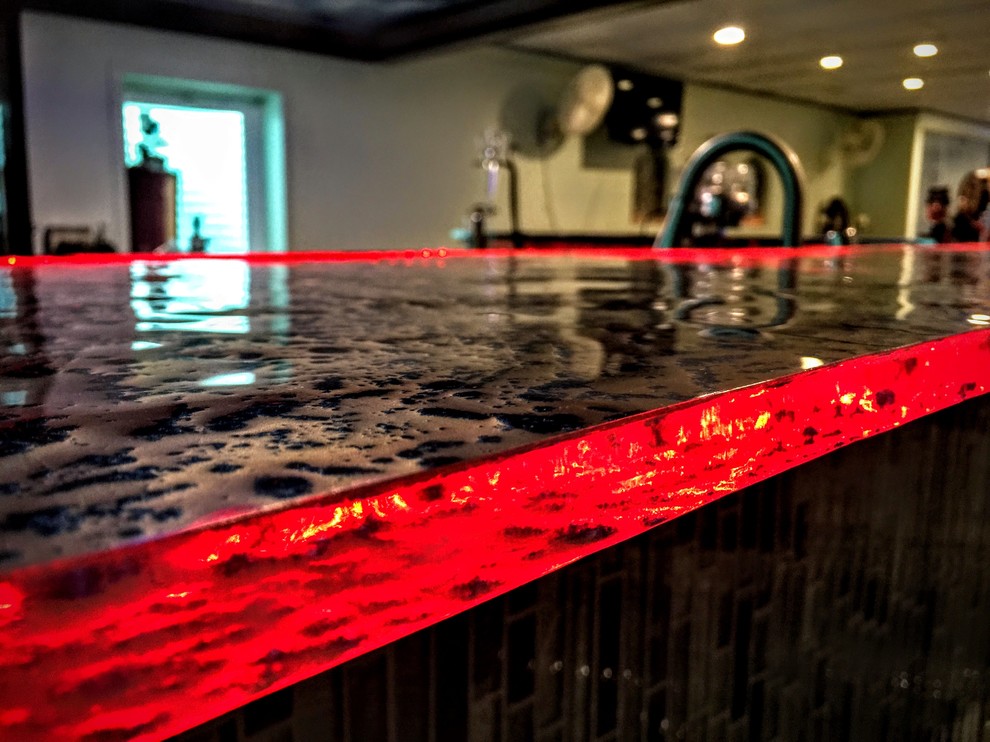 Inspiration for a modern kitchen in Chicago with glass benchtops.