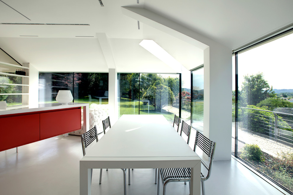 Design ideas for a contemporary dining room in Turin with white walls and porcelain floors.