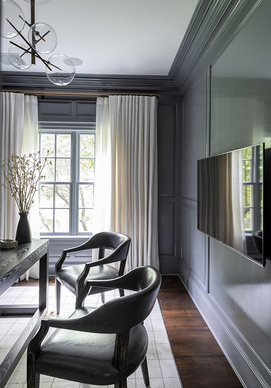 Inspiration for a classic study in Boston with grey walls, dark hardwood flooring, a freestanding desk and wainscoting.