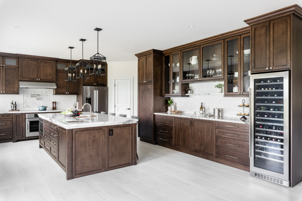 Example of a large transitional u-shaped porcelain tile and white floor open concept kitchen design in Vancouver with an undermount sink, recessed-panel cabinets, dark wood cabinets, quartz countertops, white backsplash, ceramic backsplash, stainless steel appliances, an island and white countertops