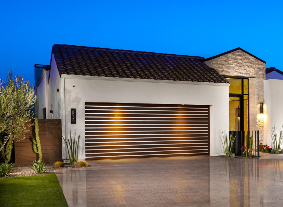 Inspiration for a large contemporary attached two-car garage in Phoenix.