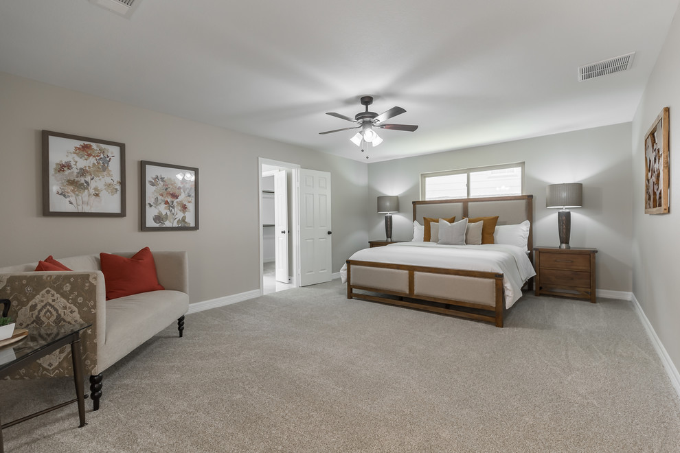 Large traditional master bedroom in Dallas with beige walls, carpet, no fireplace and beige floor.