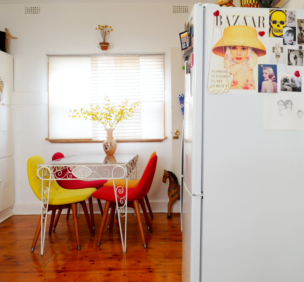 Photo of an eclectic eat-in kitchen in Melbourne.