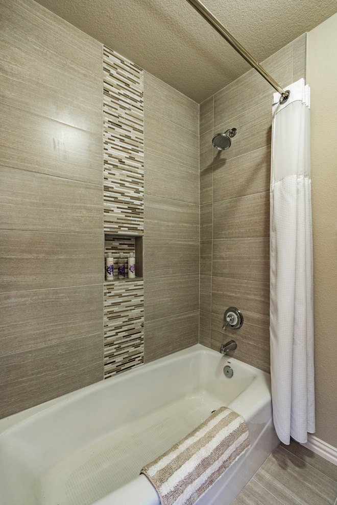 Photo of a small transitional master bathroom in Other with recessed-panel cabinets, dark wood cabinets, an alcove tub, a shower/bathtub combo, beige tile, porcelain tile, beige walls, laminate floors, a vessel sink, quartzite benchtops, beige floor, a shower curtain and white benchtops.