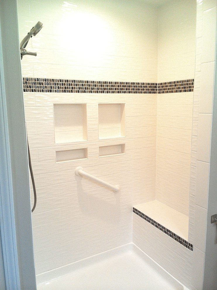Example of a small transitional master beige tile and ceramic tile ceramic tile and beige floor bathroom design with shaker cabinets, white cabinets, beige walls, an integrated sink, granite countertops and brown countertops