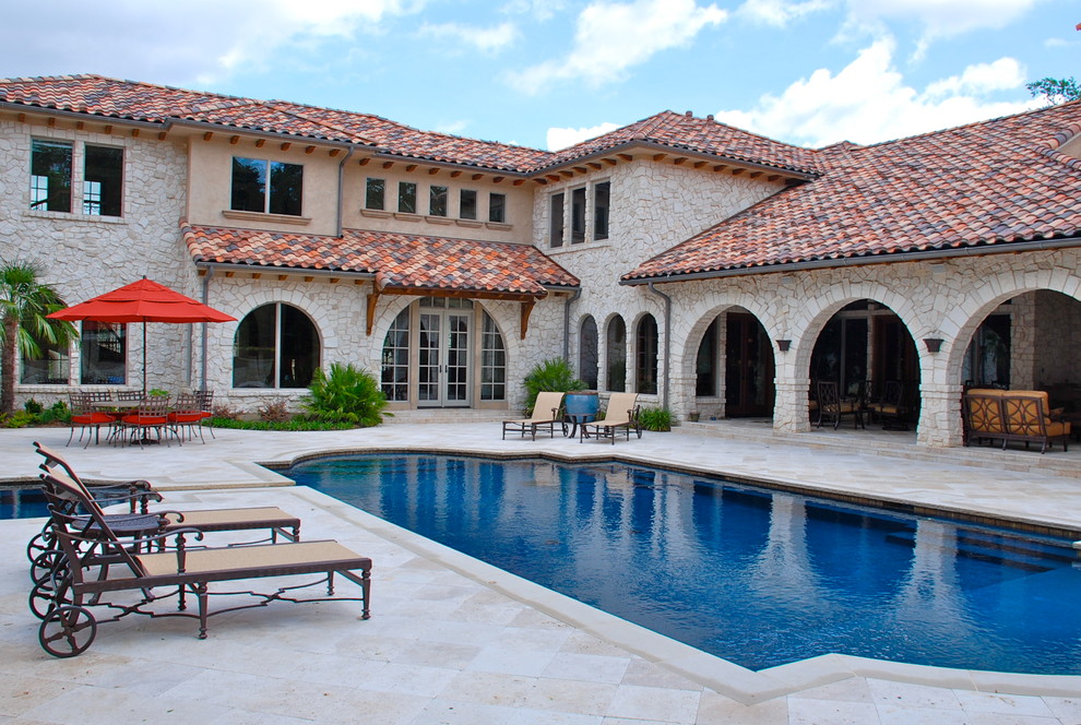 Inspiration for a mid-sized mediterranean courtyard rectangular pool in Dallas.