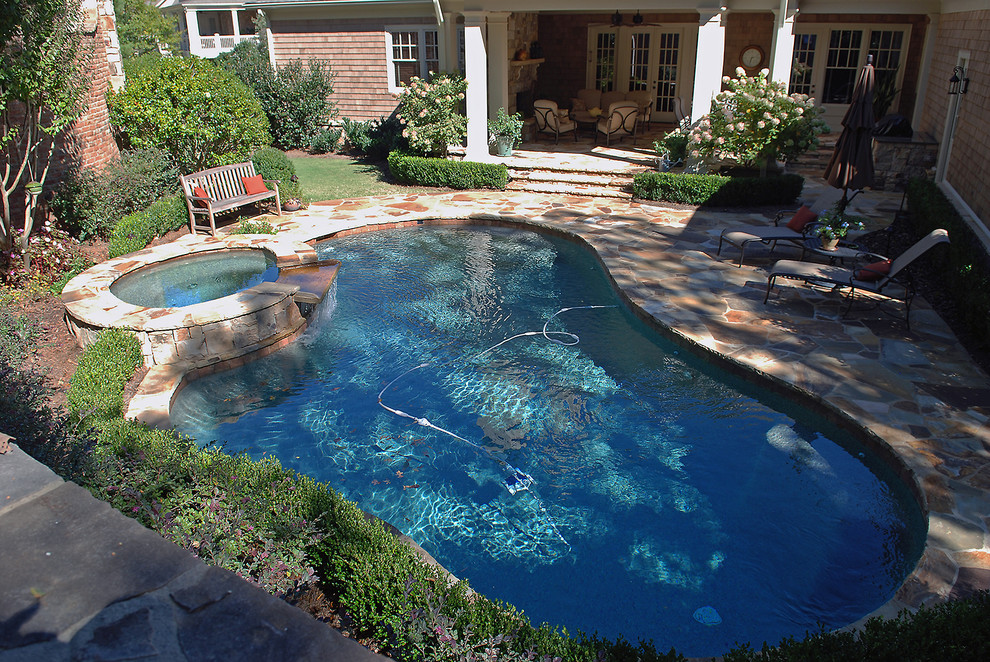 This is an example of a small arts and crafts backyard pool in Atlanta.