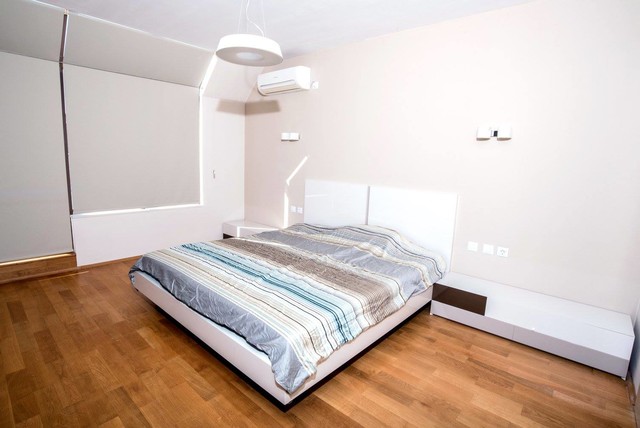 White and Brown contemporary-bedroom