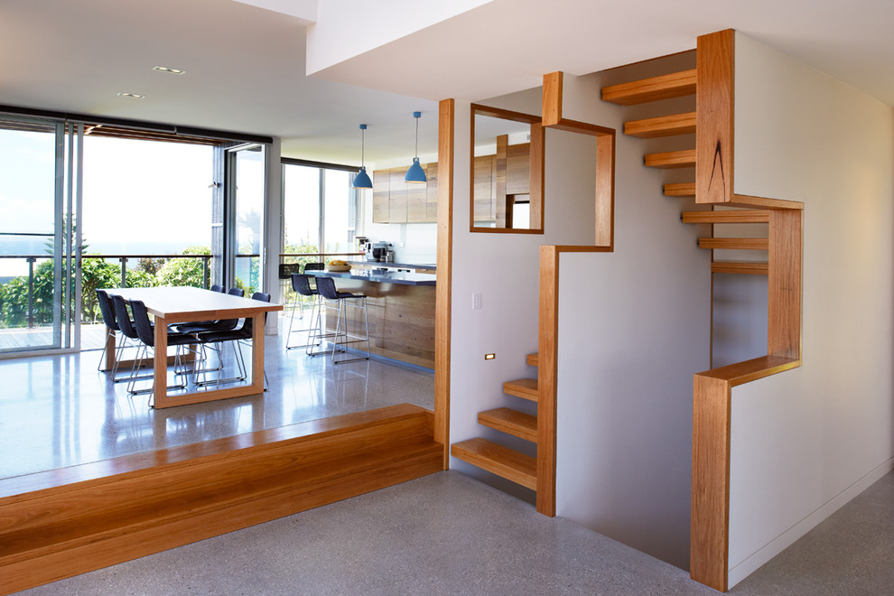 Design ideas for a mid-sized contemporary wood floating staircase in Sydney with open risers.