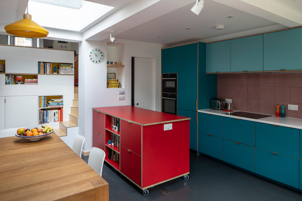 Contemporary grey and teal kitchen in London.