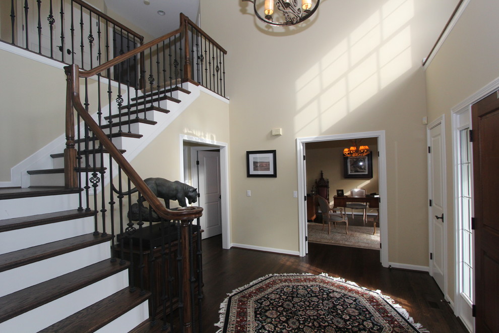 Inspiration for a mid-sized transitional wood l-shaped staircase in Cincinnati with wood risers.