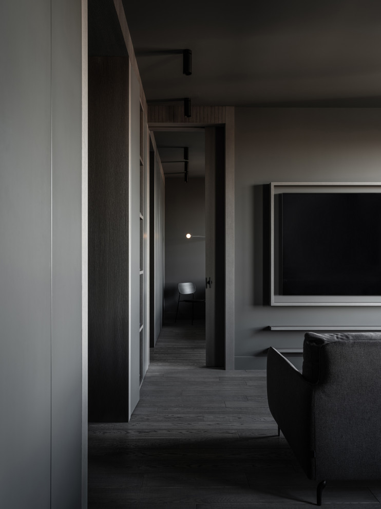 Пример оригинального дизайна: серо-белая гостиная комната среднего размера в стиле лофт с серыми стенами, полом из известняка и серым полом