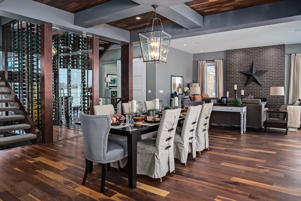 This is an example of a large transitional open plan dining in Calgary with grey walls and medium hardwood floors.