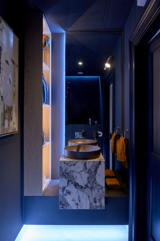 Design ideas for a small modern cloakroom in Other with a wall mounted toilet, blue walls, ceramic flooring, white floors and feature lighting.