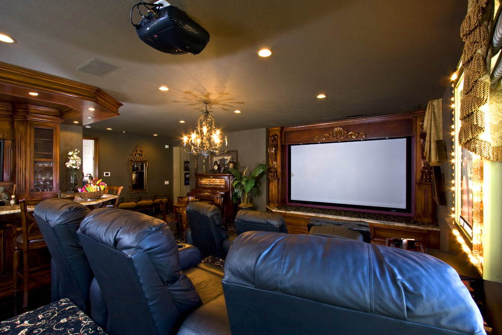 Photo of a mid-sized traditional enclosed home theatre in Orange County with carpet, green walls, a built-in media wall and multi-coloured floor.