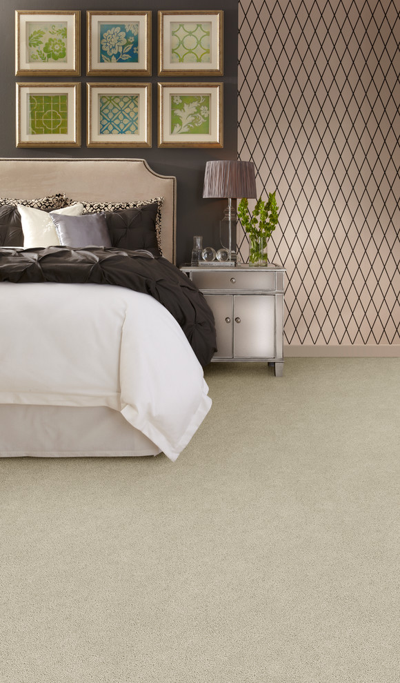 Inspiration for a mid-sized transitional master bedroom in Calgary with grey walls, carpet and no fireplace.