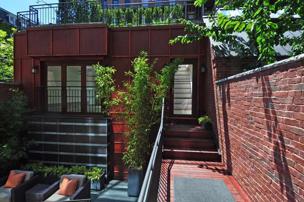 Design ideas for a mid-sized contemporary rooftop deck in Boston with a container garden and no cover.